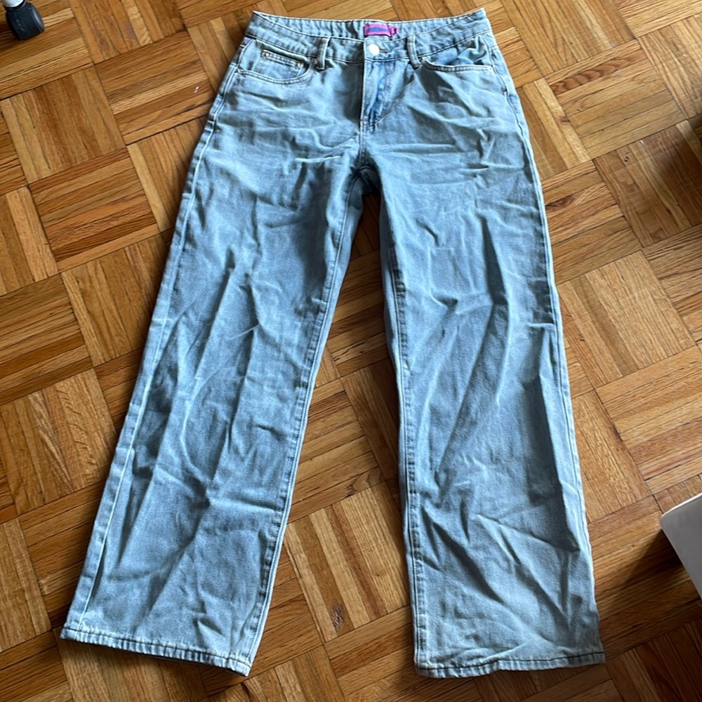 Wide leg low rise jeans with pink bows on the pocket